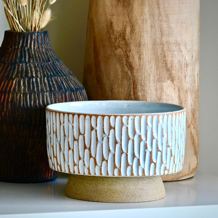 Large Designer luxury handcrafted statement piece ceramic bowl in stone ware with terracotta and white minimalist glazing.