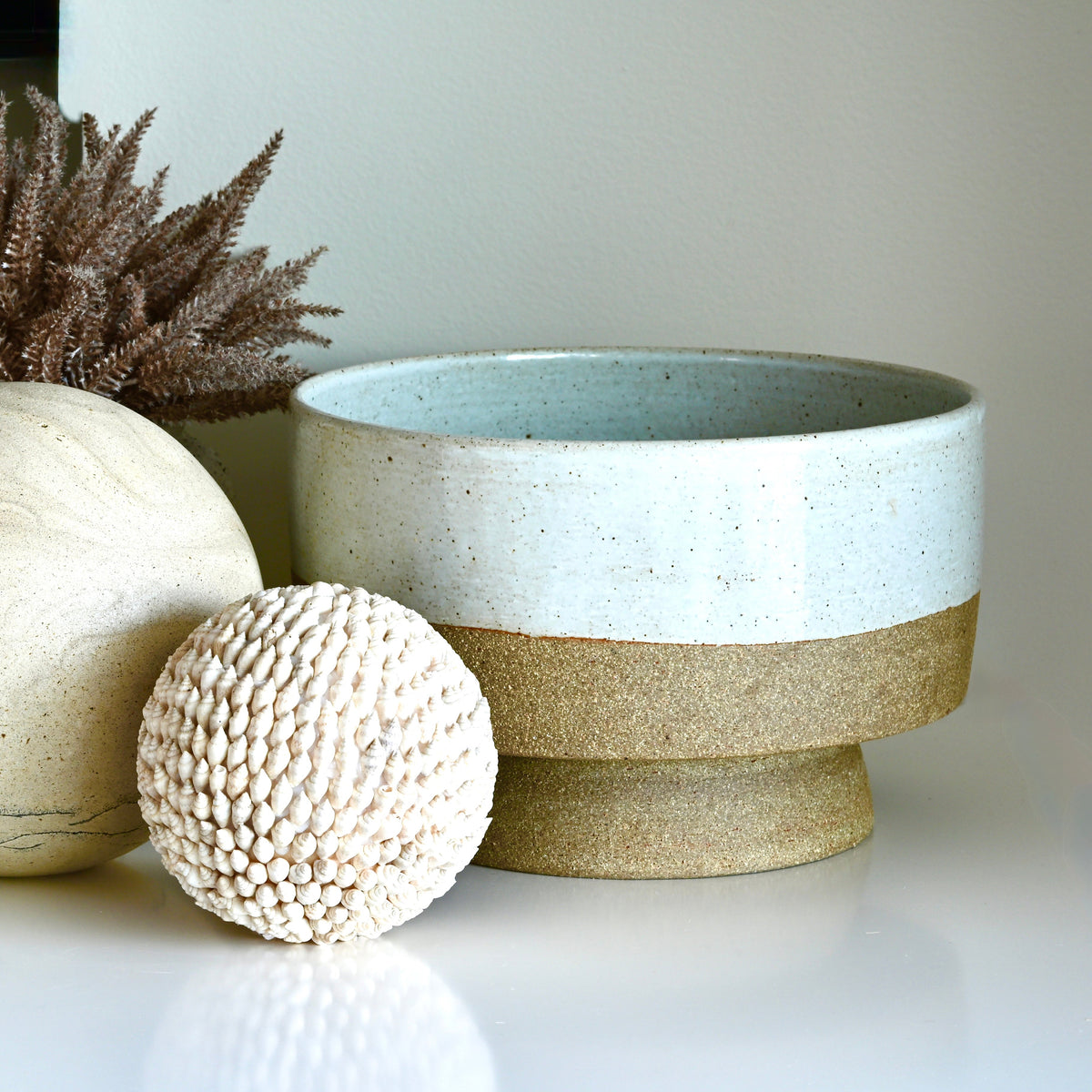 Large Designer luxury statement piece ceramic vessel in stoneware with partial milky white glaze.